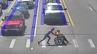 'Spider-Man' to the rescue - Helps man in wheelchair cross street