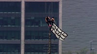 Empire State Building climbers display quote on banner: What does it say?