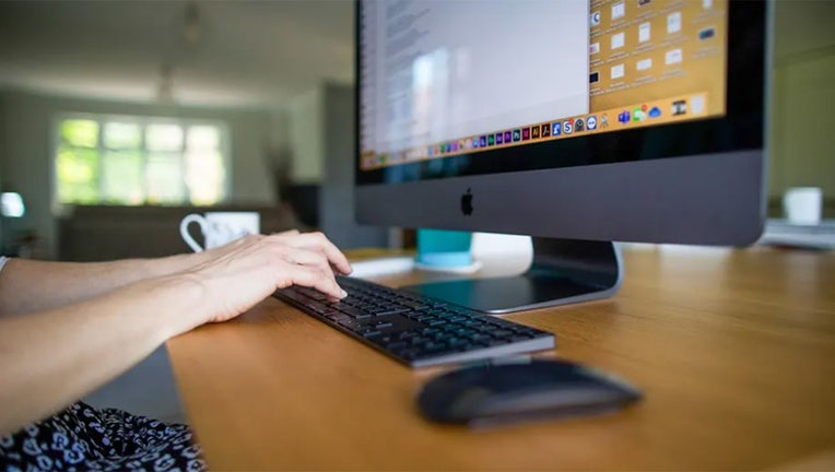 Hands typing on keyboard