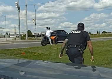 Watch: Fleeing suspect with "Run This" on license plate gets tackled by officer