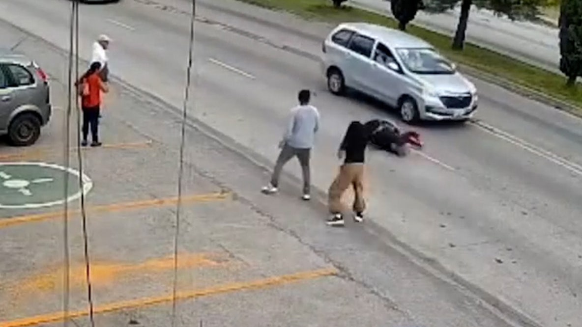Watch: Supermarket manager races to save child from traffic