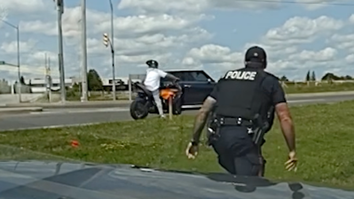 Watch: Fleeing suspect with "Run This" on license plate gets tackled by officer