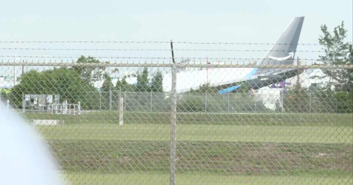 Flames seen after Amazon plane overshoots runway at Miami airport
