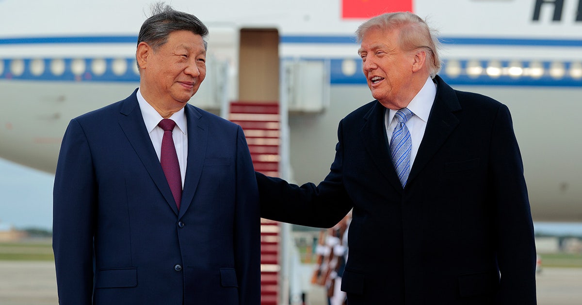 Trump welcomes China’s Xi with rare planeside greeting ahead of talks