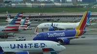 Major airlines adjust flight schedules as jet fuel prices surge