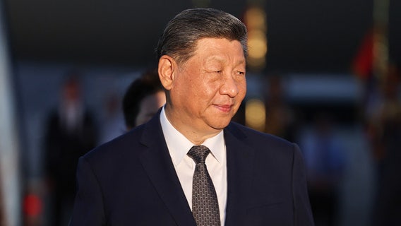 Trump welcomes China’s Xi with rare planeside greeting ahead of talks