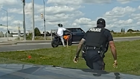 Watch: Fleeing suspect with "Run This" on license plate gets tackled by officer