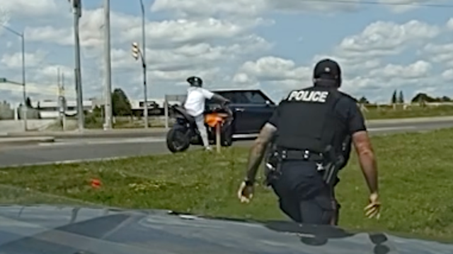 Watch: Fleeing suspect with "Run This" on license plate gets tackled by officer