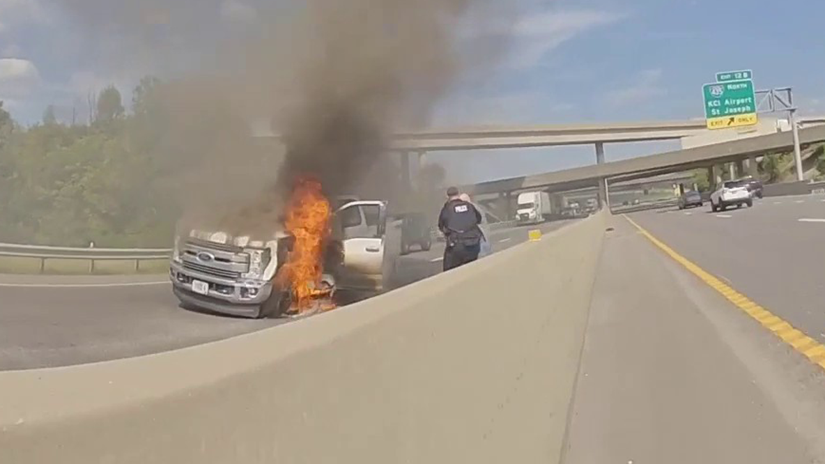 Watch: 2 off-duty officers pull man from burning truck on interstate minutes before it explodes