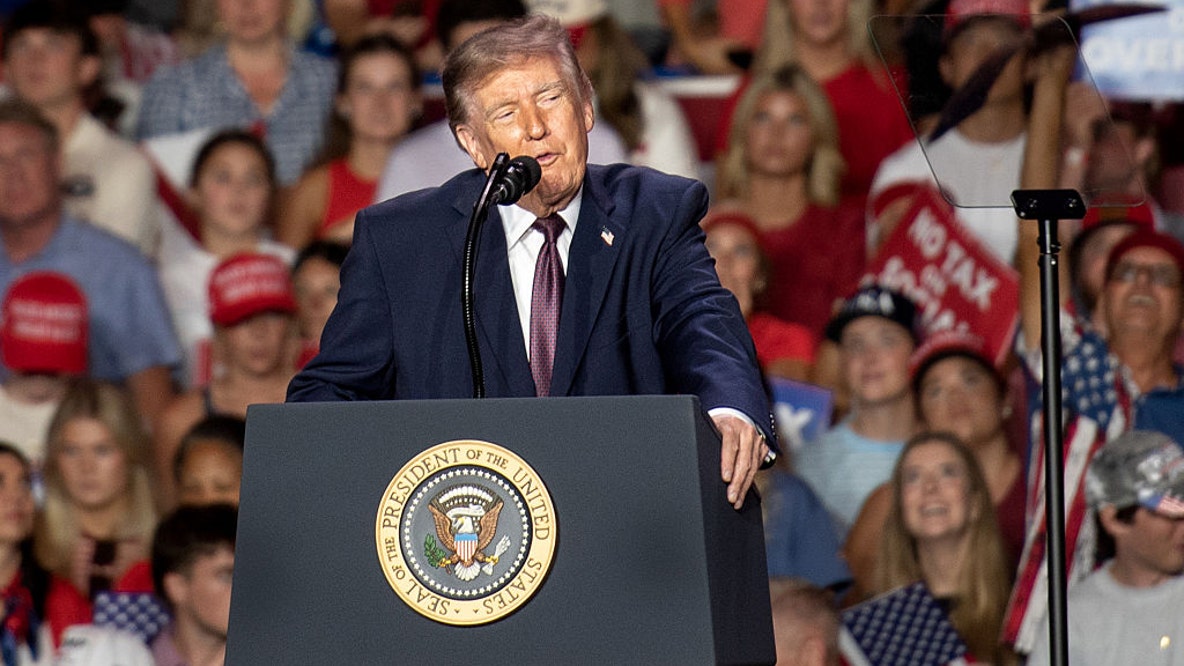 Woman federally charged over alleged threat to shoot Trump at football game