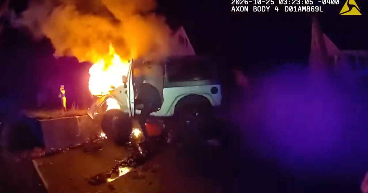 Bodycam video shows police rescuing man from burning Jeep after crash; driver facing multiple charges