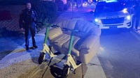 North Carolina police stop two men 'driving' couch on a public roadway