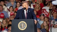Woman federally charged over alleged threat to shoot Trump at football game