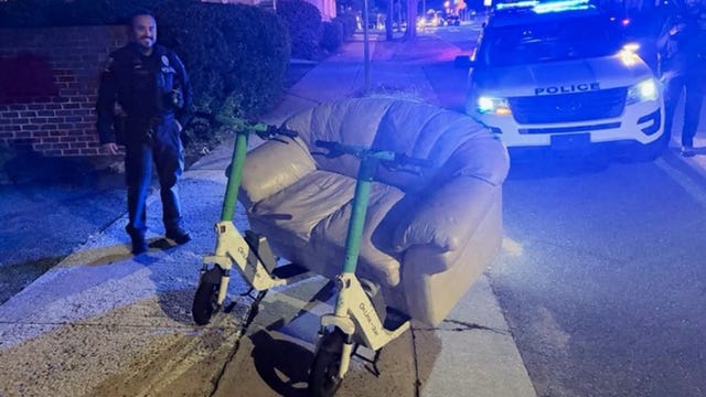 North Carolina police stop two men 'driving' couch on a public roadway