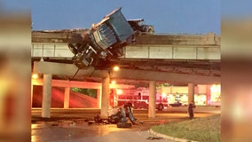 18-wheeler hangs off interstate after fiery crash