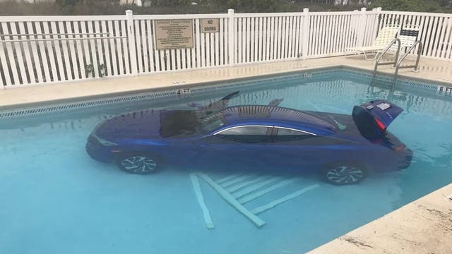 Woman fails to put car into park, it rolls into pool with husband and child inside, cops say