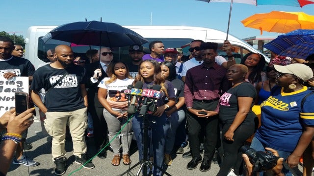 Groups of protesters gather outside Waffle House Headquarters