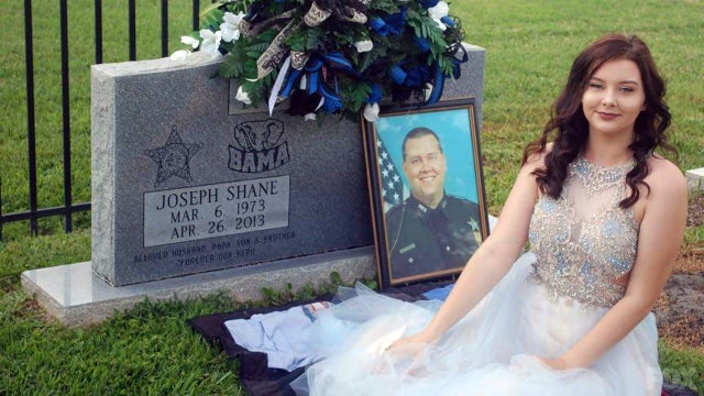 Fallen deputy's daughter remembers dad with graveside prom pics