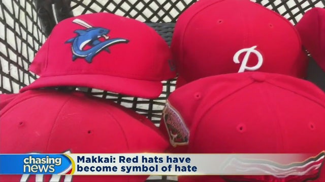 Author urges people to stop wearing red hats