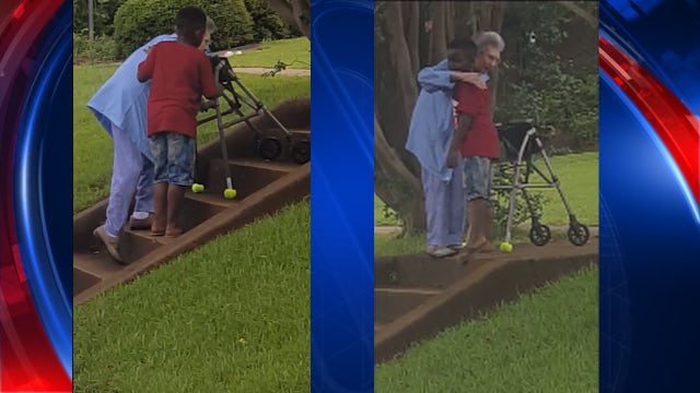 VIDEO: Young boy helps woman with walker up stairs