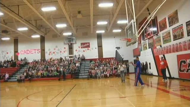 Teen with down syndrome makes backwards trick shot