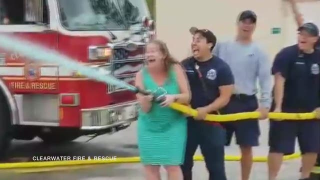 Clearwater firefighter, wife use fire hose for gender reveal
