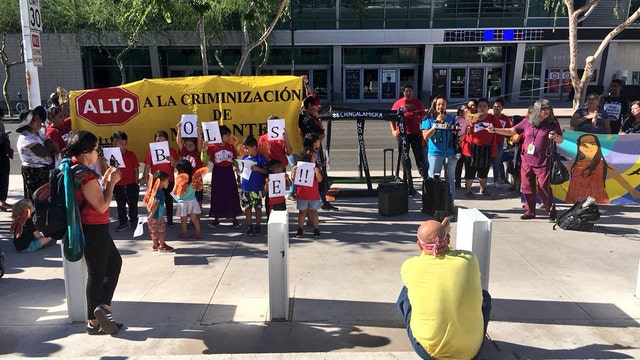 Rally against splitting of migrant families held in Phoenix, as controversy mounts over new policy