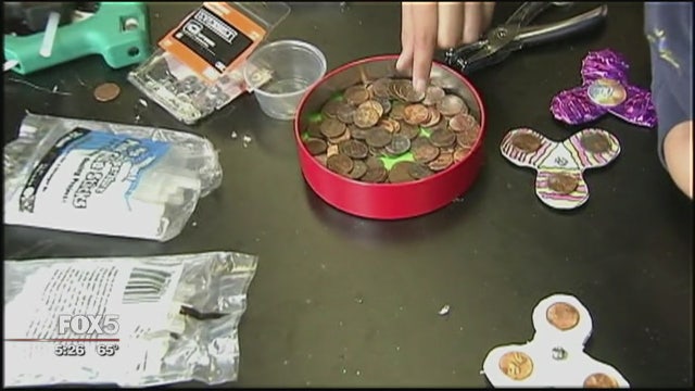 NJ schoolkids build fidget spinners in science class