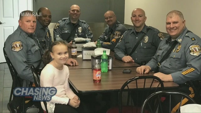 Police honor 8-year-old who paid for officer's meal