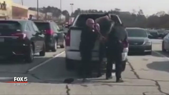 Officer placed on leave following video of ex-football player's arrest