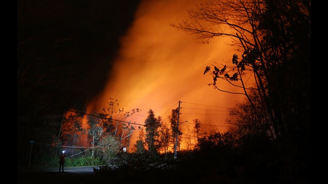 Hawaii volcano erupts from summit, shooting plume of ash