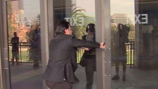 Store owners accused of selling fake merchandise avoids FOX 11 cameras during court appearance