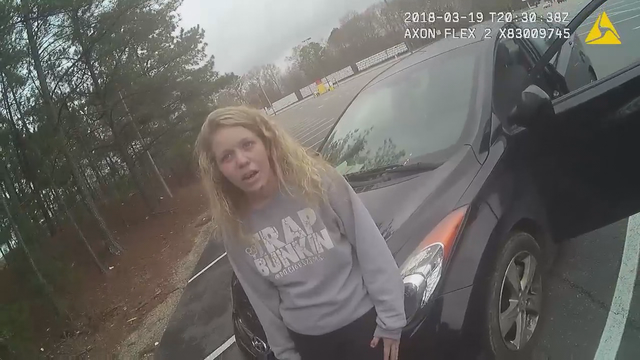 Video: Police confront mother accused of smoking drugs in car with child inside