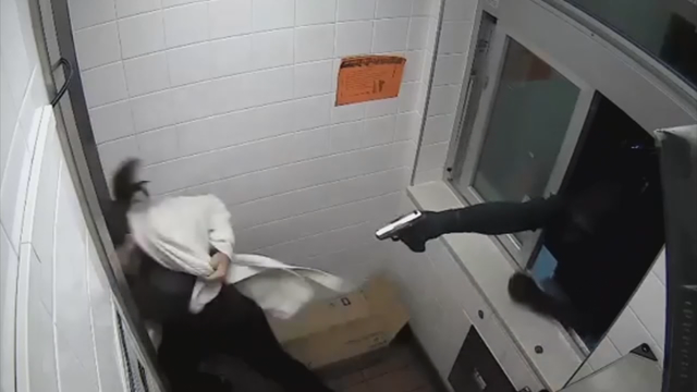 Bold bandit crawls through drive-thru window