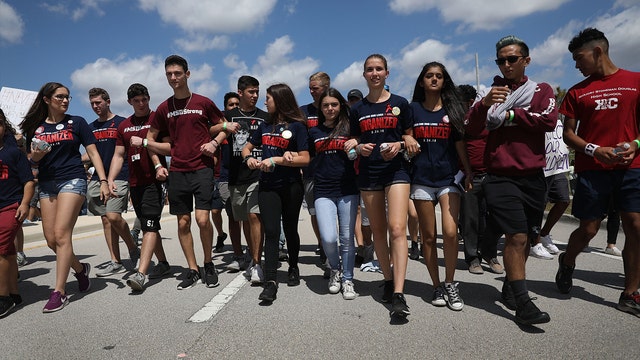 Protesters go silent during march at Parkland high school in honor of victims