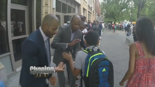 Politician and local men cheer on students