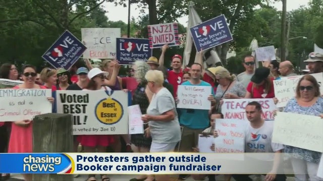 Protesters gather outside Booker fundraiser