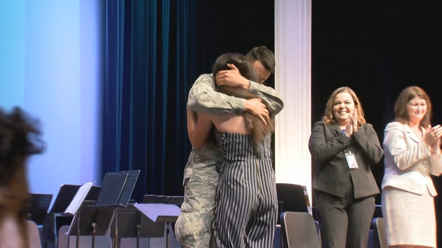 Soldier surprises sister at her middle school graduation