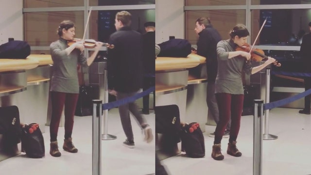 Violinist serenades stranded passengers at JFK