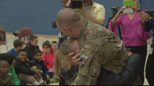 Soldier surprises daughter at school after returning home from final deployment in Afghanistan