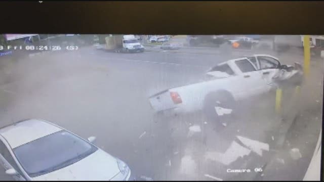 Pickup truck narrowly misses couple, plows into donut shop