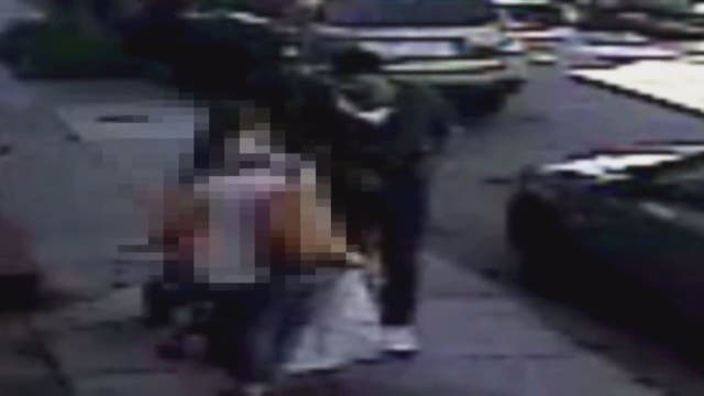 VIDEO: Suspect robs woman at gunpoint in front of her young child riding bicycle