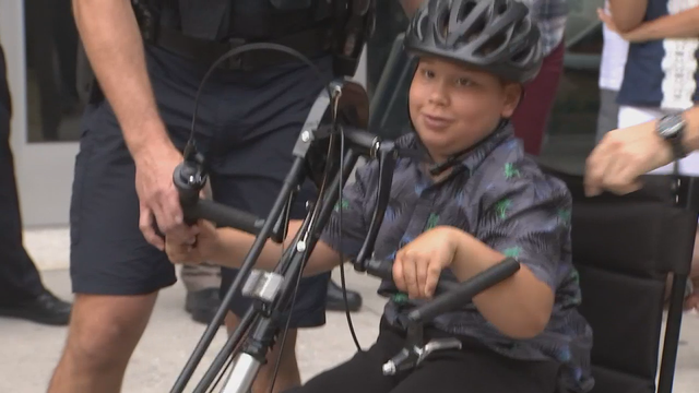Police give boy with spina bifida specially-designed bike