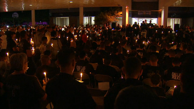 Candlelight vigil honors fallen Dallas officer