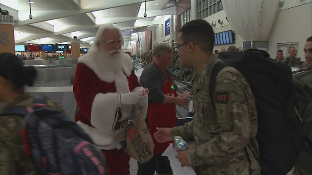 Volunteers greet soldiers at Atlanta's airport headed home for holidays