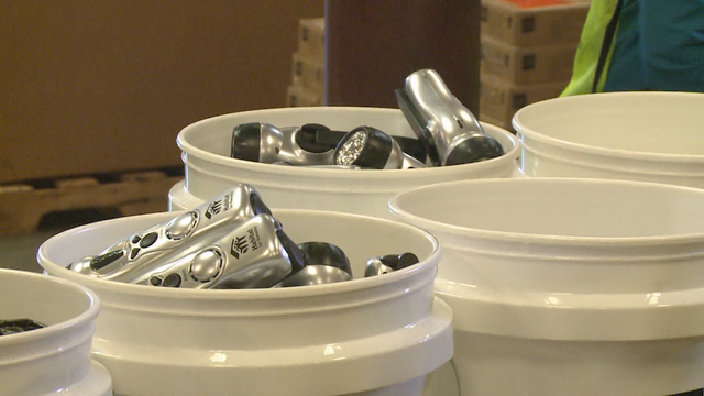 Volunteers work to assemble repair kits for Puerto Rico homes