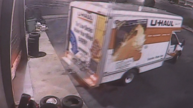 VIDEO: U-Haul seen backing into auto repair business