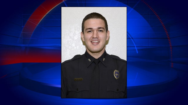 Doctor: Florida officer shot in standoff is in coma