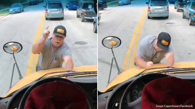 Angry Baltimore County man clings to school bus (VIDEO)