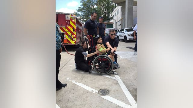 Houston boy recovering from spine surgery becomes honorary firefighter